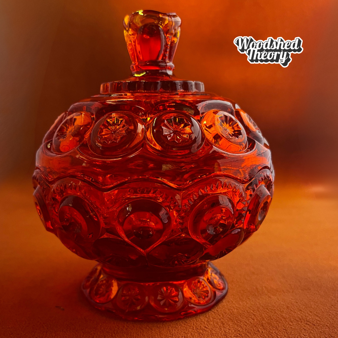 Vintage L.E. Smith Moon & Stars red glass lidded compote candy dish with cadmium glow under black light front