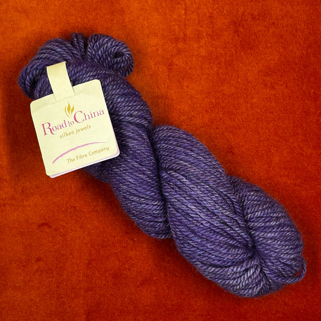 Hank of Road to China by The Fiber Company in Rose de France – soft pink yarn made with baby alpaca, camel, cashmere, yak, and soya fiber, sport weight. top down
