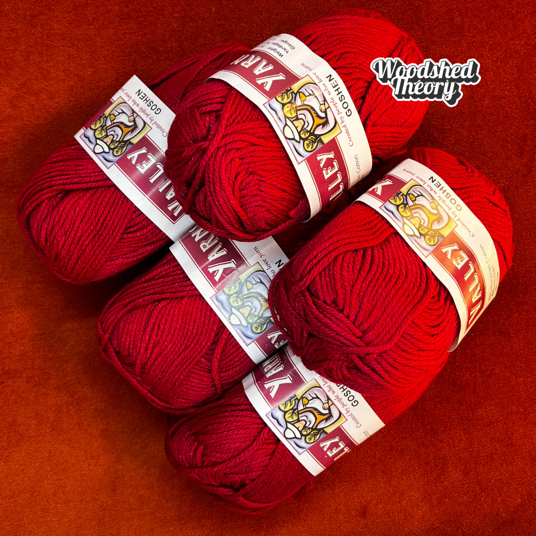 Five balls of Valley Yarns Goshen in vibrant red (color 06), cotton/modal/silk blend yarn, stacked neatly in a bundle.