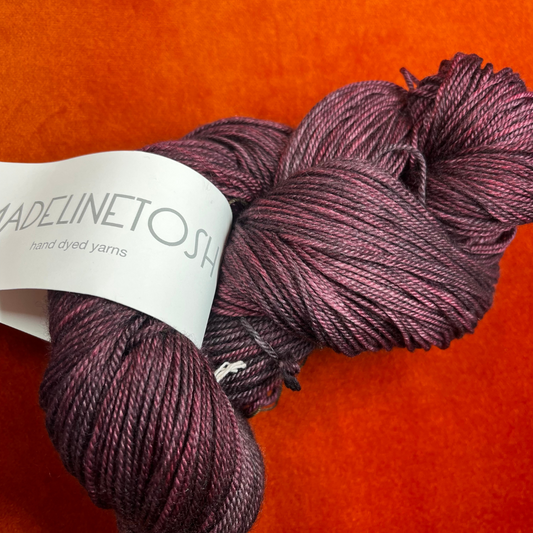 One skein of Madeline Tosh Pashmina yarn in Oxblood – a hand-dyed sport weight blend of merino, silk, and cashmere.close up