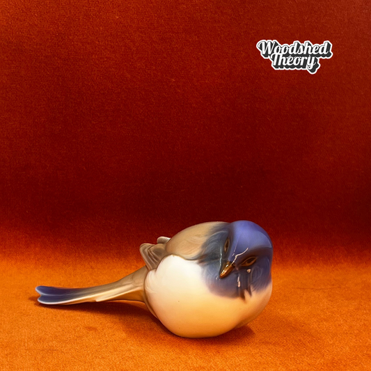 Vintage porcelain figurine of a titmouse bird by Bing & Grøndahl, model 1635, in natural colors. facing forward