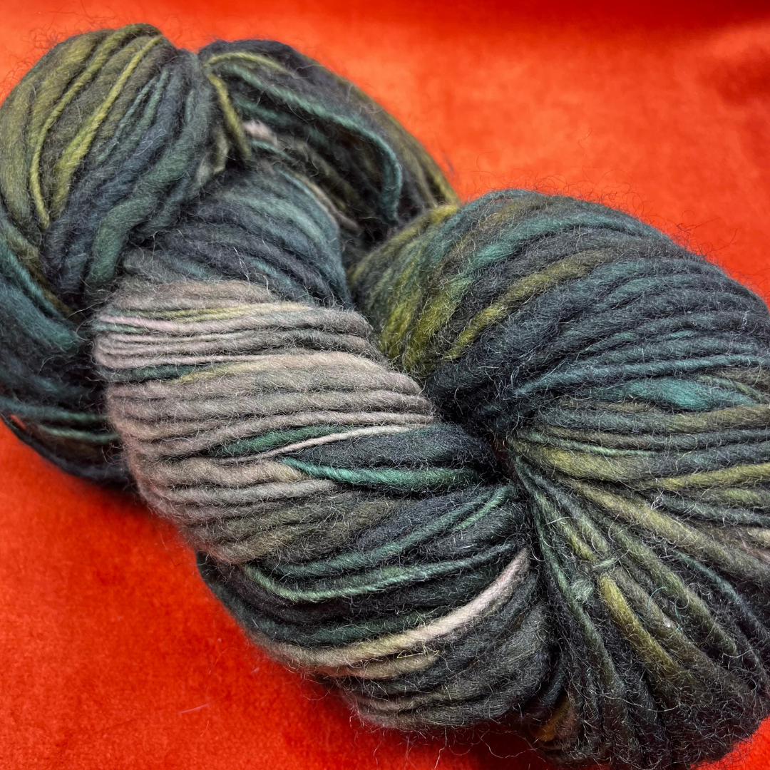 MANOS del Uruguay pure wool kettle dyed yarn in Color 101 (greens and taupe). 138 yards of roving-weight artisan wool. Handcrafted, fair trade. close up colors