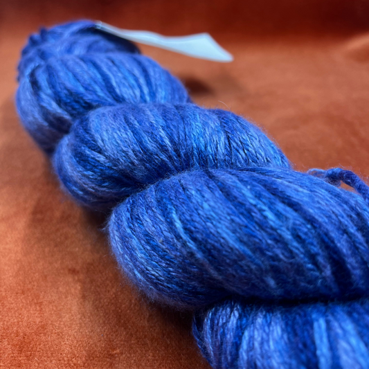 Crystal Palace Panda Pearl yarn in color 9214—luxury bamboo, merino, and silk DK blend in rich shades of blue. close up
