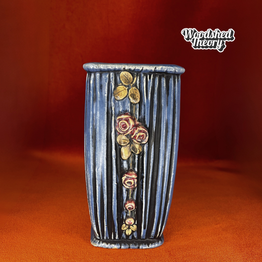 Weller pottery vase with blue drapery design and trailing pink roses, circa 1915, with small chips on the base. front