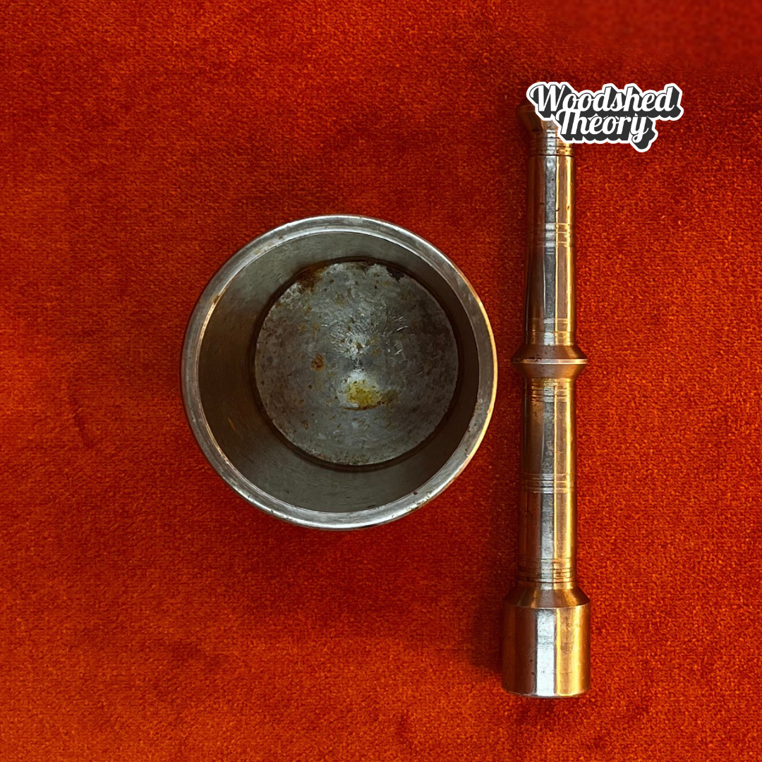 Vintage miniature silver metal mortar and pestle with patina and "O S" stamp on base. top down