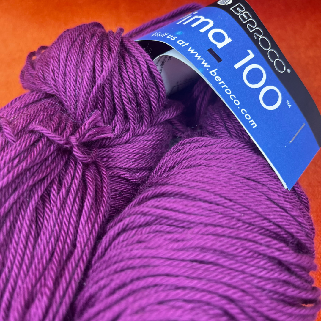 Two skeins of Berroco Pima 100 yarn in color Fox Glove (8444), soft matte pink worsted weight cotton yarn. close up