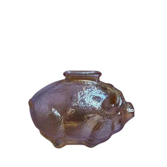 A small pig-shaped glass vase with a textured, ribbed surface and a short cylindrical neck, shown on a plain white background.