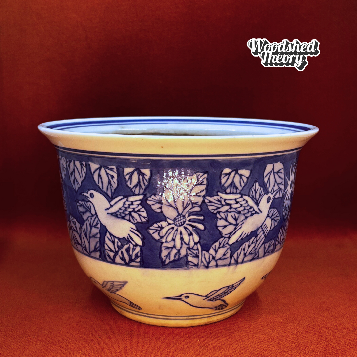 Blue and white hand-painted ceramic planter featuring Chinoiserie-style hummingbirds and foliage. Front