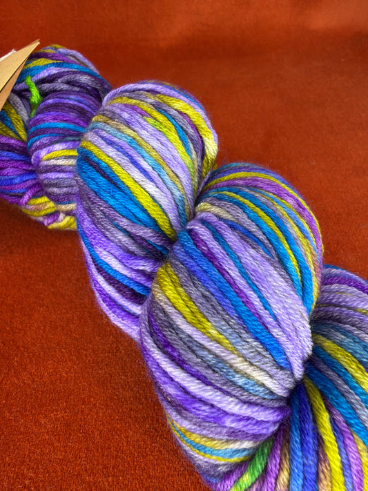Uneek Worsted by Urth Yarns Color 4003 Lot 26521 (Blues, Purples, Chartreuse Green) close up