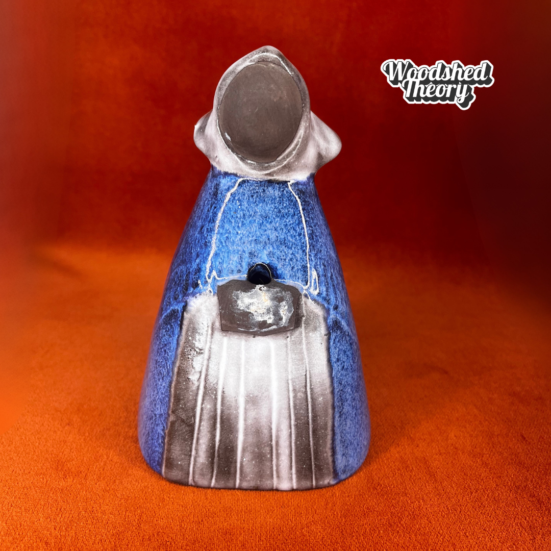 Vintage Swedish pottery flower holder designed by Elsi Bourelius for Jie Gantofta, featuring a ceramic girl figure with original stickers, circa mid-century. front