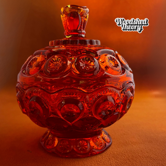 Vintage L.E. Smith Moon & Stars red glass lidded compote candy dish with cadmium glow under black light front