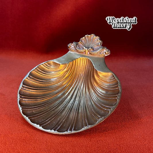 Small vintage bronze shell-shaped trinket dish on pedestal feet, made in India front