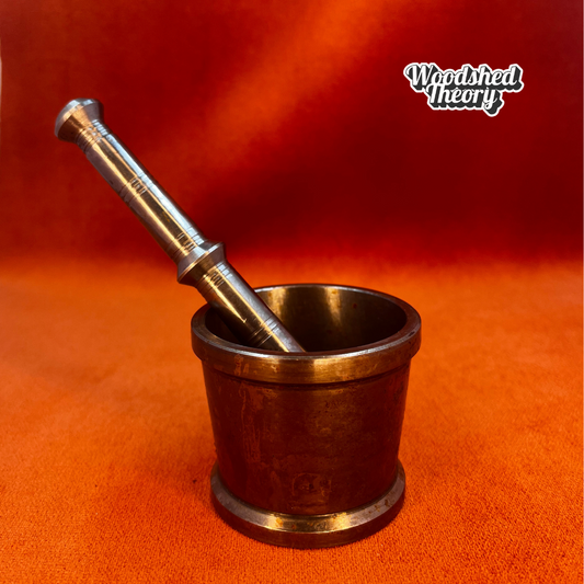 Vintage miniature silver metal mortar and pestle with patina and "O S" stamp on base. front 