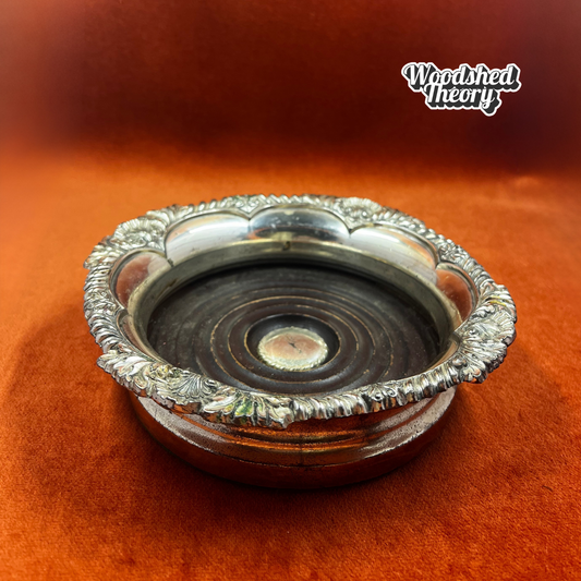 Vintage Corbell & Co. silver plate wine or champagne coaster with shell design and felt bottom. side 