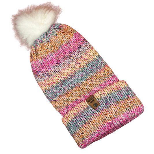 Pink, blue, and orange multi-color knit beanie with faux fur pom and cork tag, hand crafted by Woodshed Theory flat front