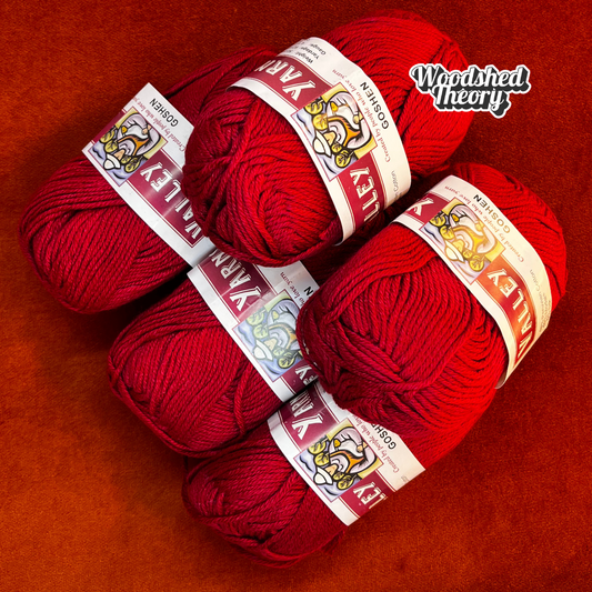 Five balls of Valley Yarns Goshen in vibrant red (color 06), cotton/modal/silk blend yarn, stacked neatly in a bundle.
