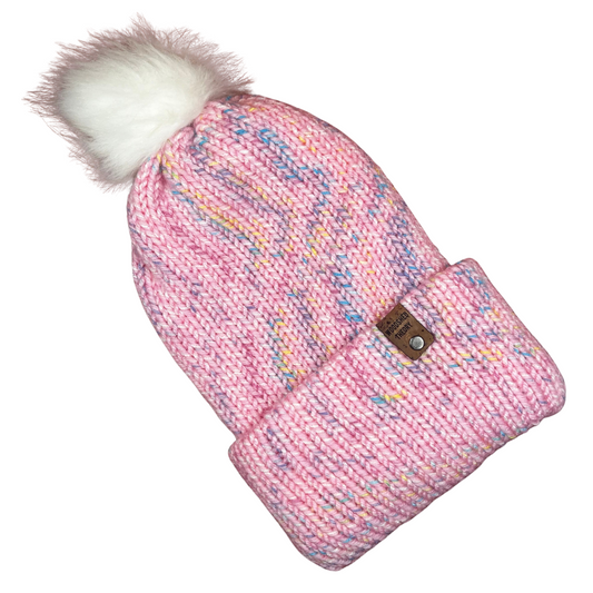 Pink knitted hat and mitten set with a white pom-pom on a white background spring beanie in pink front 