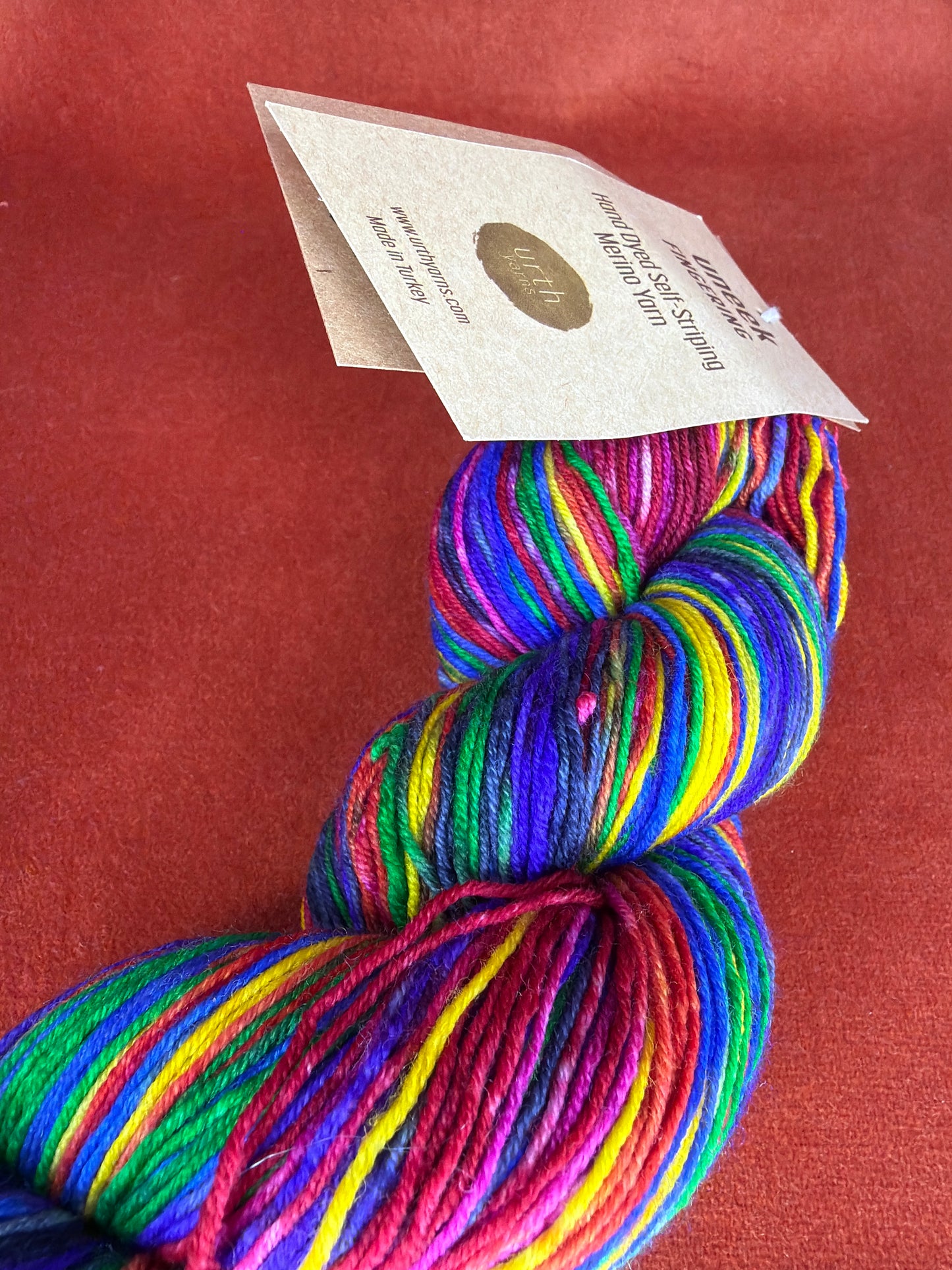 1 Hank Uneek Fingering by Urth Yarns Color 3004 (Rainbow) close up 