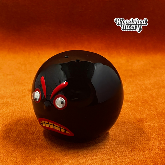 Vintage angry bowling ball pepper shaker with googly eyes from VandoRama Lanes. side eye