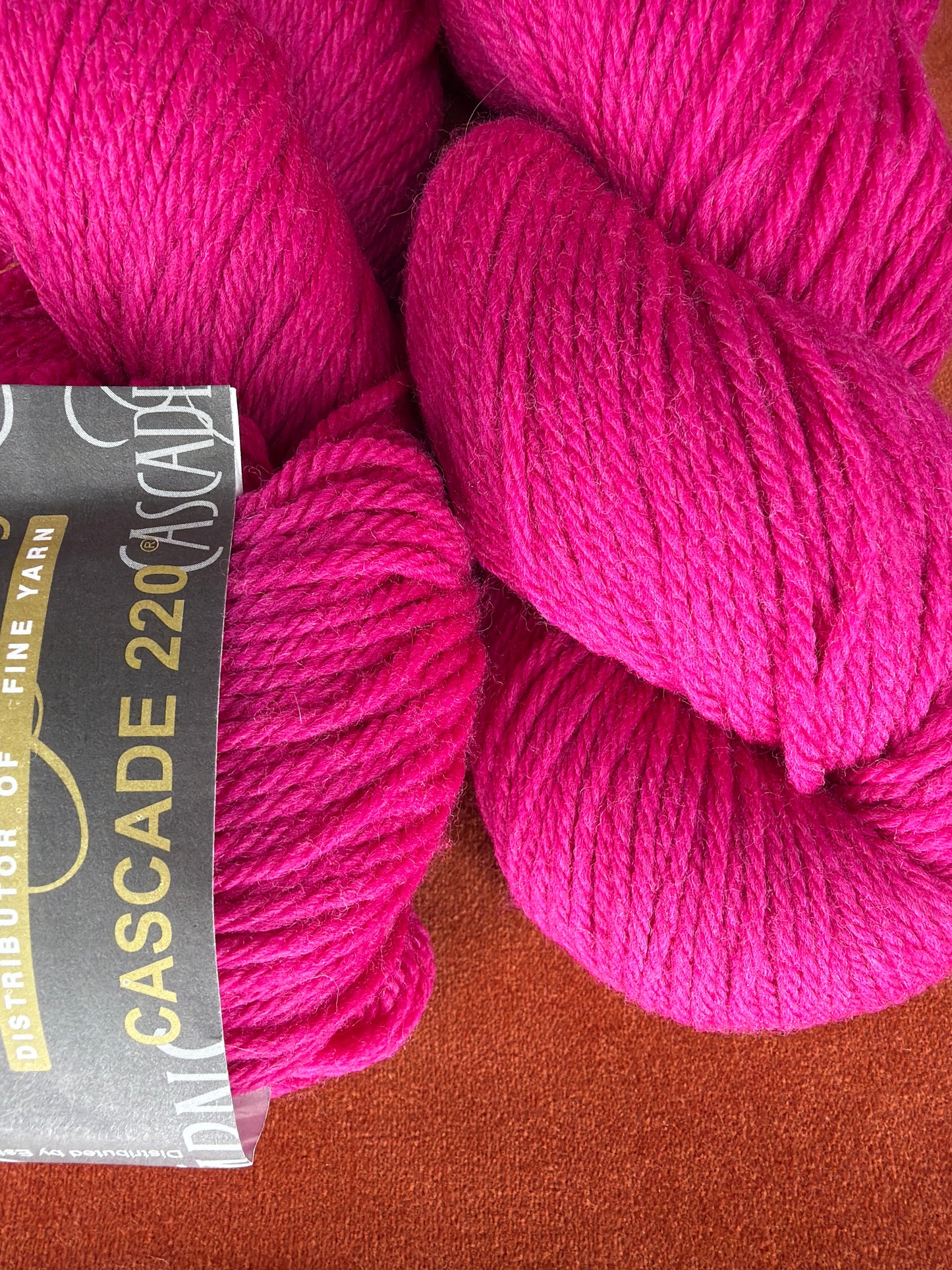 2 Hanks Cascade 220 Col. 7802 Cerise close up