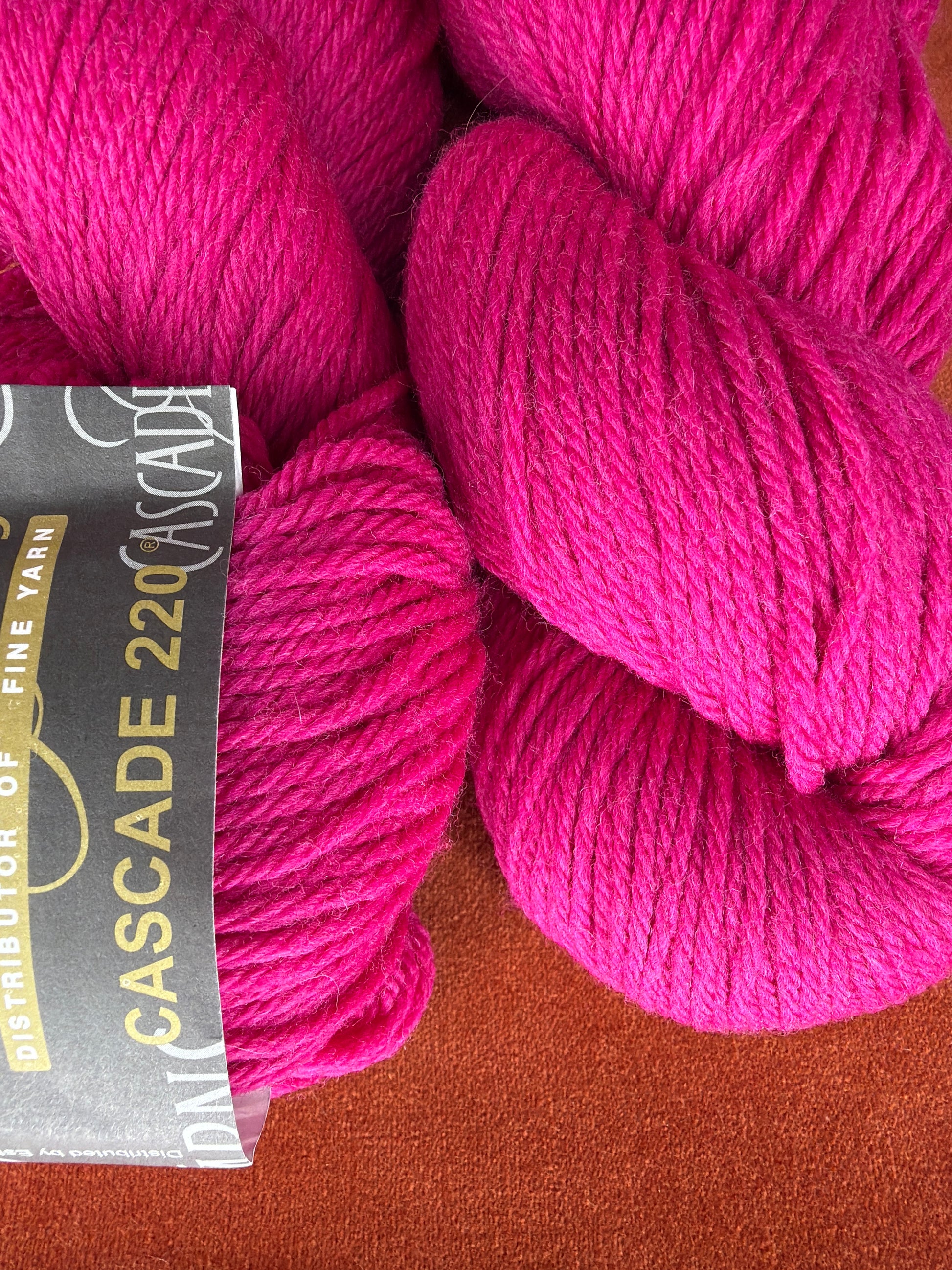 2 Hanks Cascade 220 Col. 7802 Cerise close up