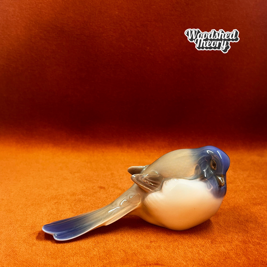 Vintage porcelain figurine of a titmouse bird by Bing & Grøndahl, model 1635, in natural colors.front right side