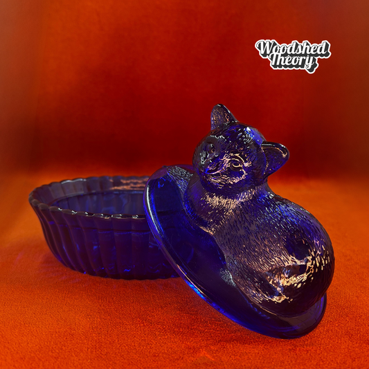 Vintage Westmoreland cobalt blue glass cat on nest dish with lid, shown from side angle. open lid