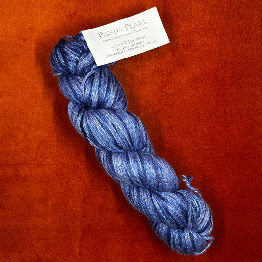 Crystal Palace Panda Pearl yarn in color 9214—luxury bamboo, merino, and silk DK blend in rich shades of blue. top down