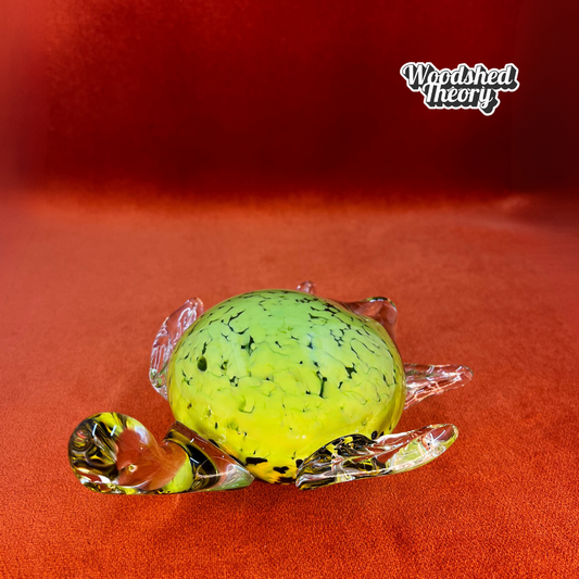Vintage Fifth Avenue Crystal sea turtle paperweight in light green handblown glass with speckled shell. face forward 
