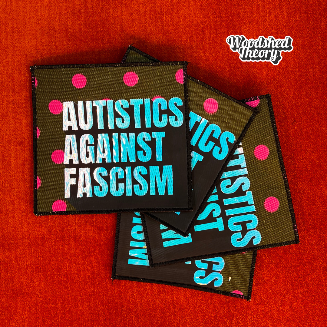 Square iron-on patch with "Autistics Against Fascism" in purple iridescent letters on olive green fabric with pink polka dots. Approx. 4.5 inches square. good trouble group 