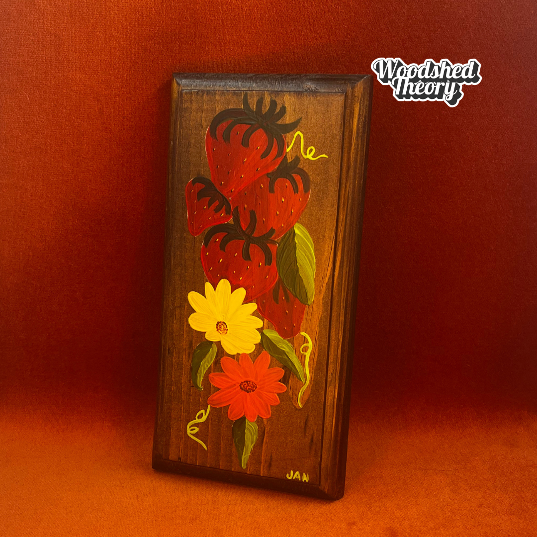 Hand-painted 1970s wooden kitchen wall hanger with daisies and strawberries; signed "JAN" with DIY soda tab hanger. front