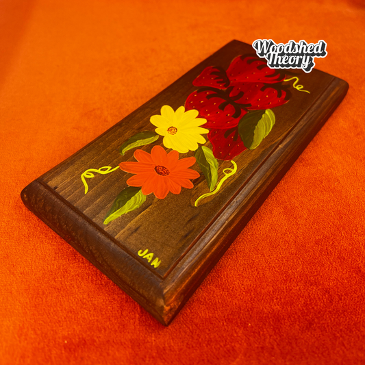 Hand-painted 1970s wooden kitchen wall hanger with daisies and strawberries; signed "JAN" with DIY soda tab hanger. close up