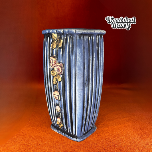 Weller pottery vase with blue drapery design and trailing pink roses, circa 1915, with small chips on the base. side angle 