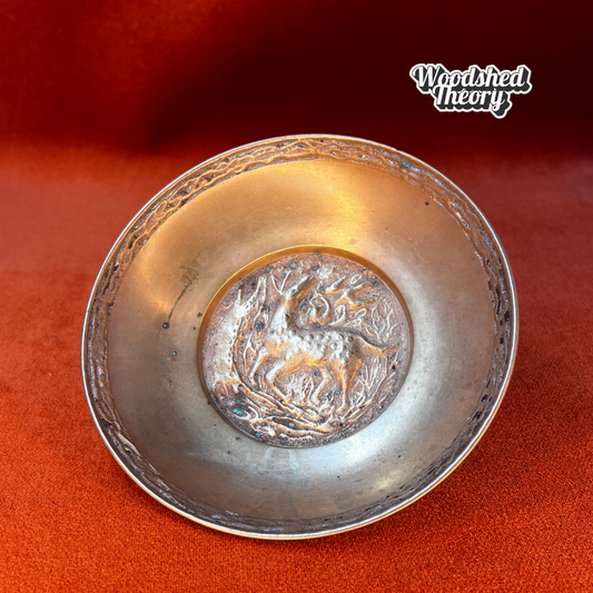 Solid bronze vintage ring dish showing a fawn walking in a wooded scene, stamped “Korea” on the bottom. front