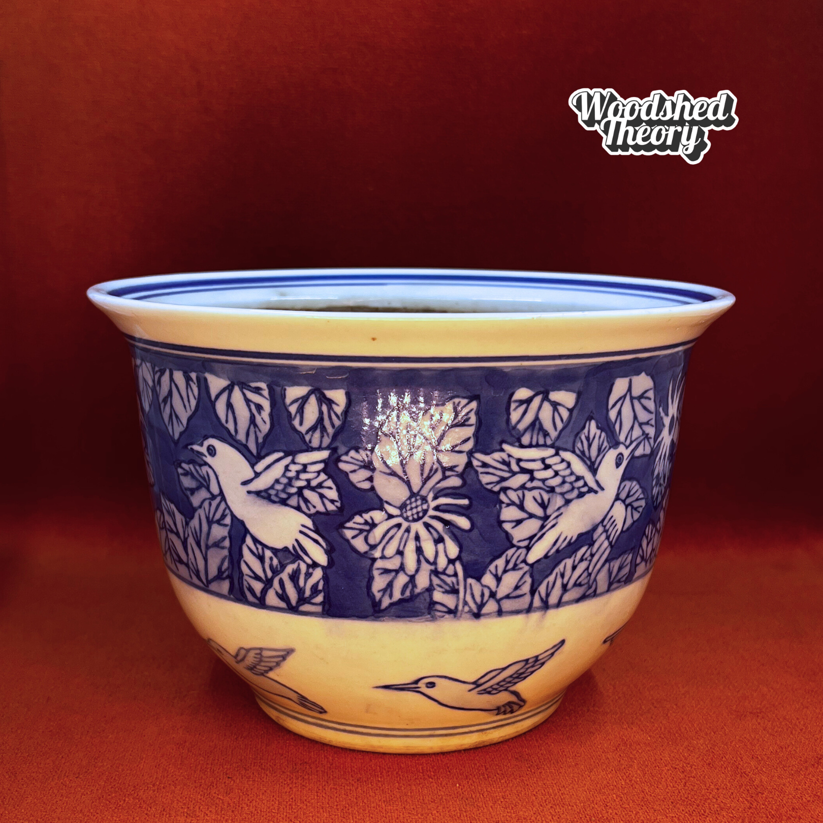 Blue and white hand-painted ceramic planter featuring Chinoiserie-style hummingbirds and foliage. Front 