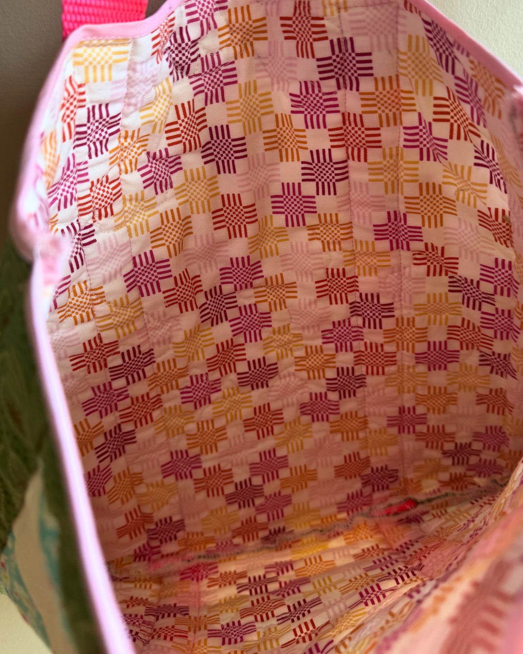 Close-up of a fabric with a colorful geometric pattern.