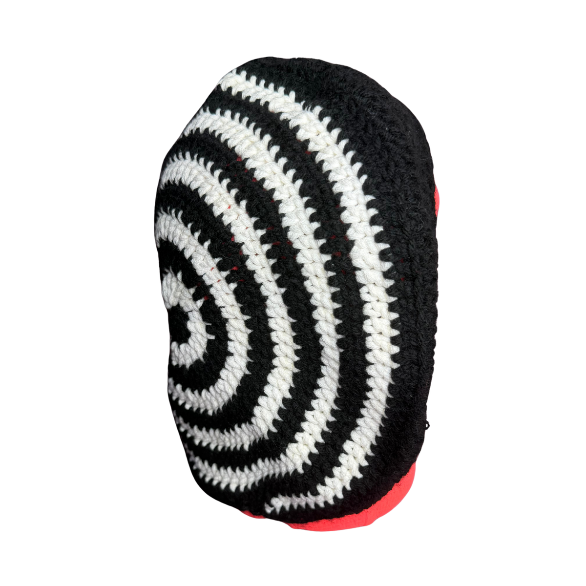 A black and white striped knit cap with a red inner lining, shown from a side angle against a plain white background.