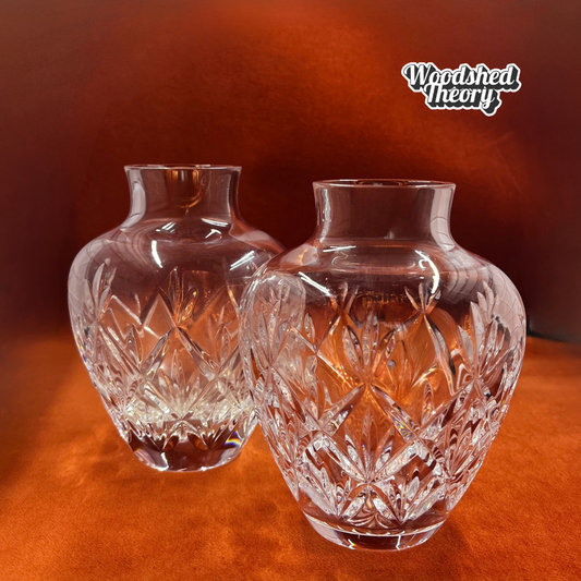 Pair of Tiffany & Co Sybil 6” crystal cut flower vases, retired collectible set on orange background