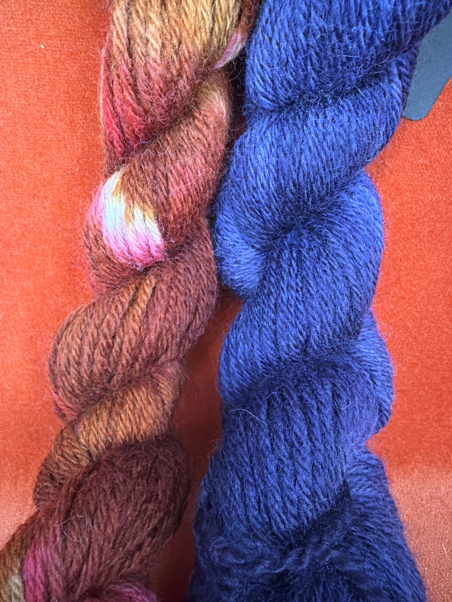 Unlabeled Hand-Dyed Reds/Browns and Navy (2 Small Hanks) close up 