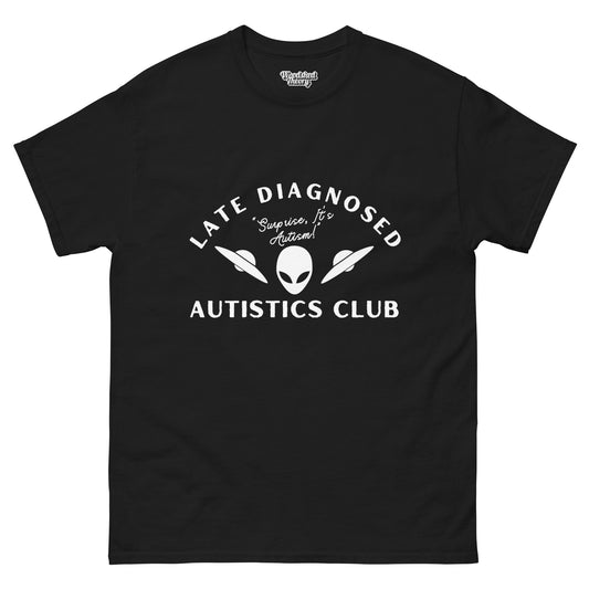Black cotton t-shirt with white text reading 'Late Diagnosis Autism Club – Surprise, it's autism!' — neurodivergent pride apparel by Woodshed Theory